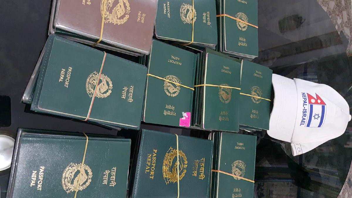 Israel sends the 1st batch of 100 passports for Auxiliary Workers to DoFE