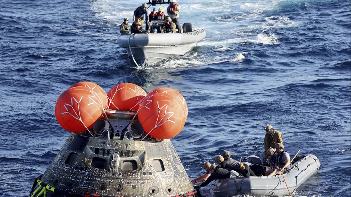 NASA Orion capsule safely blazes back from moon, aces test