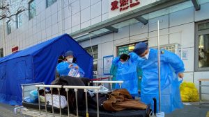 China’s stretched health system braces for peak in COVID infections