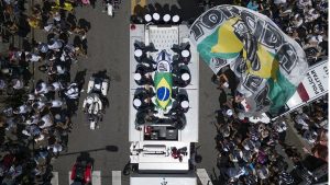 Pelé buried at cemetery in Brazilian city he made famous