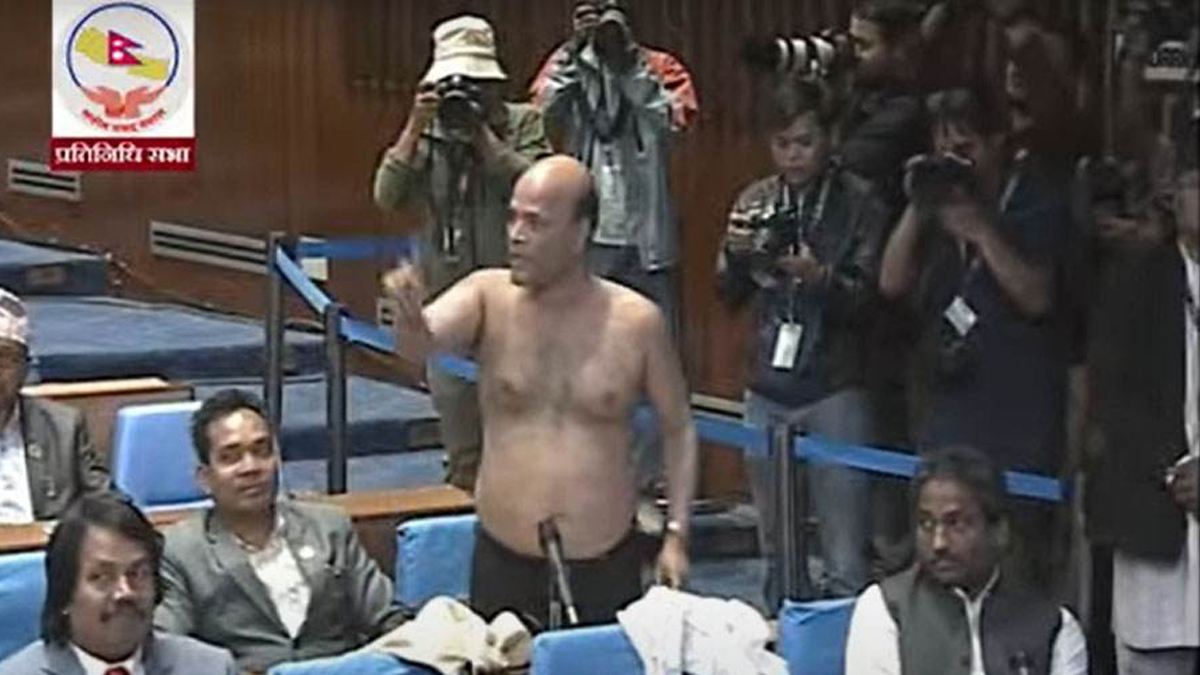 Shocking scene in Parliament as lawmaker strips shirt in protest