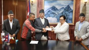 CPN (Maoist Centre) hands over cheque for Rs 5 million to PM  disaster relief fund